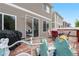 Relaxing backyard deck with furniture and ' play equipment; perfect outdoor living space at 5536 Kirk St, Denver, CO 80249