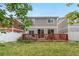 View of the spacious backyard and wood deck, perfect for outdoor entertaining and relaxation at 5536 Kirk St, Denver, CO 80249