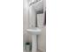 Compact bathroom featuring a pedestal sink, providing a clean and functional space at 5536 Kirk St, Denver, CO 80249