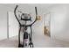 Exercise room featuring an elliptical machine, with access to the bathroom for added convenience at 5536 Kirk St, Denver, CO 80249