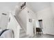 Bright hallway leading to a staircase and other rooms in the home at 5536 Kirk St, Denver, CO 80249