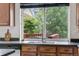 Kitchen sink area with stainless steel faucet and view of exterior deck at 5536 Kirk St, Denver, CO 80249