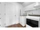Functional laundry room featuring modern washing machines and ample space for convenience at 5536 Kirk St, Denver, CO 80249