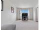 Bright living room featuring white walls, neutral carpet, and a large window at 5536 Kirk St, Denver, CO 80249