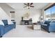 Comfortable living room with a cozy electric fireplace and neutral decor at 5536 Kirk St, Denver, CO 80249