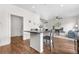 Open layout of breakfast bar overlooking living room and electric fireplace at 5536 Kirk St, Denver, CO 80249