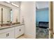 Bright bathroom with double sink vanity next to the Bedroom at 6264 E 143Rd Dr, Thornton, CO 80602