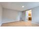Bright bedroom with wood floors, an en-suite bathroom, and ample closet space at 10723 Cherry Ct, Thornton, CO 80233