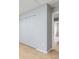 Bedroom with ample storage featuring large closets and light hardwood floors at 10723 Cherry Ct, Thornton, CO 80233