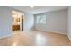 Spacious bedroom with wood floors, a large window, and an en-suite bathroom at 10723 Cherry Ct, Thornton, CO 80233