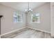 Bright dining room with modern flooring, a chandelier, and natural light at 10723 Cherry Ct, Thornton, CO 80233
