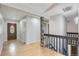 Inviting foyer with tiled floors, leading to the upper and lower levels of the home at 10723 Cherry Ct, Thornton, CO 80233