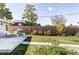 Large backyard with patio, lawn, and a wood fence at 1531 W Dakota Ave, Denver, CO 80223