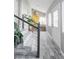 Entryway with gray tile floor, stairs and plants at 1531 W Dakota Ave, Denver, CO 80223