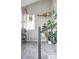 Entryway with gray tile floors and many plants at 1531 W Dakota Ave, Denver, CO 80223