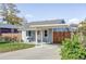 Charming bungalow with light blue siding, carport, and landscaped yard at 1531 W Dakota Ave, Denver, CO 80223