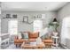 Living area with a brown leather couch, decorative pillows, and a coffee table at 1531 W Dakota Ave, Denver, CO 80223