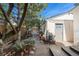Backyard stone patio with access to alley and coach house at 623 S Logan St, Denver, CO 80209