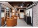 Finished basement featuring seating, brick accents, and a unique design at 623 S Logan St, Denver, CO 80209
