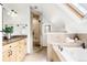 Spa-like bathroom with soaking tub, walk-in shower, and dual vanity with granite countertops at 623 S Logan St, Denver, CO 80209
