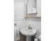 Charming bathroom with a pedestal sink, wainscoting, and classic fixtures offering a vintage feel at 623 S Logan St, Denver, CO 80209