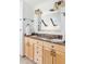 Bathroom features a double vanity with granite countertops, wood cabinets, and modern fixtures at 623 S Logan St, Denver, CO 80209