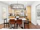 Bright dining room features modern light fixture, wood floors, and a spacious seating area at 623 S Logan St, Denver, CO 80209