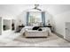 Stylish bedroom with vaulted ceiling, ample natural light, and contemporary décor at 623 S Logan St, Denver, CO 80209