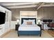 Serene bedroom with wood paneling, built-in storage, and a comfortable bed, creating a relaxing retreat at 623 S Logan St, Denver, CO 80209