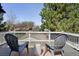 Relaxing rooftop deck with two chairs and a table, perfect for enjoying the neighborhood view at 623 S Logan St, Denver, CO 80209