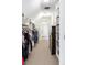 Large walk-in closet with hanging clothes, built-in shelving, and ample storage space at 623 S Logan St, Denver, CO 80209