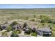 Expansive aerial view of three homes in a neighborhood nestled in a vast natural landscape at 5672 S Nome St, Englewood, CO 80111