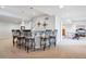 Basement with built-in bar, bar seating, and a game area at 5672 S Nome St, Englewood, CO 80111