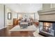 Serene main bedroom featuring a fireplace, hardwood floors, and neutral decor at 5672 S Nome St, Englewood, CO 80111