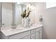 Modern bathroom with dual sinks, white quartz countertops, and stylish fixtures at 451 Interlocken Blvd # 101, Broomfield, CO 80021