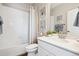 Well-lit bathroom with modern fixtures, a shower-tub combo, and elegant decor, perfect for a relaxing experience at 451 Interlocken Blvd # 101, Broomfield, CO 80021