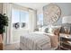 Bright bedroom with large window, soft lighting, and elegant decor for a peaceful retreat at 451 Interlocken Blvd # 101, Broomfield, CO 80021
