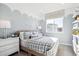 Charming bedroom with cloud accent wall, comfortable bed, and ample natural light, ideal for  at 451 Interlocken Blvd # 101, Broomfield, CO 80021