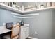 Dedicated home office space with built-in desk, shelving, and serene blue walls at 451 Interlocken Blvd # 101, Broomfield, CO 80021