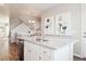 Bright kitchen with granite countertops, stainless steel appliances, and access to the dining area at 451 Interlocken Blvd # 101, Broomfield, CO 80021