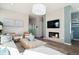 This stunning living room features a modern fireplace and sleek design, perfect for entertaining or relaxing at 451 Interlocken Blvd # 101, Broomfield, CO 80021