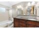 Bathroom features a double sink vanity with wooden cabinets and decorative mirrors at 80 S 38Th St, Boulder, CO 80305
