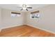 Bedroom features hardwood floors and sunlit windows with woven shades at 80 S 38Th St, Boulder, CO 80305