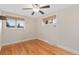 Cozy bedroom with hardwood floors, neutral paint, and ample natural light from two windows at 80 S 38Th St, Boulder, CO 80305