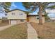 Charming split-level home with brick and siding, mature tree, and attached single-car garage at 80 S 38Th St, Boulder, CO 80305