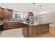 Modern kitchen with stainless steel appliances, wood cabinets, and large island with countertop at 80 S 38Th St, Boulder, CO 80305
