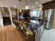 Open kitchen boasts stainless appliances, wood cabinets, and a large island with beautiful countertop at 80 S 38Th St, Boulder, CO 80305