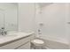 Bright bathroom features a shower-over-tub with white subway tile and a vanity with stone countertop at 6579 Parterre N Pkwy # 2, Thornton, CO 80602