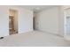 Spacious bedroom showcases a large walk-in closet and plush carpeting at 6579 Parterre N Pkwy # 2, Thornton, CO 80602