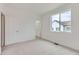 Neutral bedroom features plush carpet, a closet, and a bright window at 6579 Parterre N Pkwy # 2, Thornton, CO 80602